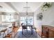 Sunlit dining area with hardwood floors, modern lighting, and stylish decor at 1063 Emerson Avenue Se, Atlanta, GA 30316