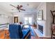 Cozy living room featuring a fireplace, hardwood floors, and a lovely front door at 1063 Emerson Avenue Se, Atlanta, GA 30316