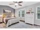 Main bedroom with a neutral color scheme, bay windows, and ample natural light at 2090 Whitestone Pl, Alpharetta, GA 30005