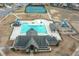 Aerial view of community pool, tennis courts, clubhouse, and playground at 58 Ashbury Cir, Dallas, GA 30157