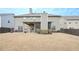 Back exterior view of the house with patio, backyard, and fenced perimeter at 58 Ashbury Cir, Dallas, GA 30157
