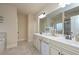 Bright bathroom featuring a double vanity with great lighting and a large walk-in shower at 58 Ashbury Cir, Dallas, GA 30157
