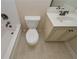 Clean bathroom featuring a combination tub/shower, toilet and vanity with sink at 58 Ashbury Cir, Dallas, GA 30157