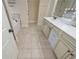 Bright bathroom with double vanity, and a soaking tub visible to the left through a door at 58 Ashbury Cir, Dallas, GA 30157