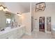 Elegant bathroom showcasing dual sinks, large mirrors, and stylish lighting fixtures at 58 Ashbury Cir, Dallas, GA 30157