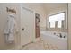 Modern bathroom featuring a soaking tub, decor and bright lighting at 58 Ashbury Cir, Dallas, GA 30157