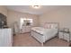 Cozy bedroom featuring a white wooden bed frame, dresser, and comfortable furnishings at 58 Ashbury Cir, Dallas, GA 30157