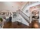 Elegant entryway with hardwood floors, a staircase with iron railings, and views into the living room at 58 Ashbury Cir, Dallas, GA 30157