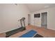 Neutral home gym features vaulted ceilings, a treadmill and ample space at 58 Ashbury Cir, Dallas, GA 30157