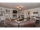 Spacious living room with stone fireplace, tile floors, ceiling fan, and adjacent rooms in view at 58 Ashbury Cir, Dallas, GA 30157