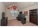 Home office with Coca Cola decor, desk, shelves, and natural light from window at 58 Ashbury Cir, Dallas, GA 30157