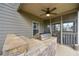 Stone outdoor kitchen with grill on the patio with screened in porch access at 58 Ashbury Cir, Dallas, GA 30157