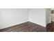Bedroom with neutral walls, wood floors, bright lighting, and white baseboards at 840 United Se Ave # 411, Atlanta, GA 30312