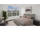 Comfortable bedroom with a large window offering scenic views, plush bedding, and contemporary decor at 840 United Se Ave # 411, Atlanta, GA 30312