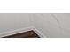 A closet with wood floors and white walls and baseboards. Has a wire rack shelving unit at 840 United Se Ave # 411, Atlanta, GA 30312