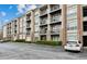 Attractive multi-story apartment building with brick and stone accents, balconies, and well-maintained landscaping at 840 United Se Ave # 411, Atlanta, GA 30312