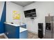Office kitchenette featuring modern amenities, stylish decor, a stainless steel refrigerator, and a sleek water dispenser at 840 United Se Ave # 411, Atlanta, GA 30312