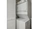 Stacked washer and dryer inside the laundry room at 840 United Se Ave # 411, Atlanta, GA 30312