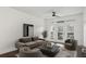 Bright living room with hardwood floors, modern furnishings, and access to a private balcony with outdoor seating at 840 United Se Ave # 411, Atlanta, GA 30312