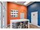 Modern lounge area featuring a white high-top table with seating and vibrant wall decor at 840 United Se Ave # 411, Atlanta, GA 30312