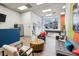 Lounge area with comfortable seating, a pool table in the distance, and a brightly lit atmosphere at 840 United Se Ave # 411, Atlanta, GA 30312