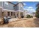 Backyard featuring a patio, outdoor seating, and a grill, perfect for outdoor entertaining at 126 Maple Creek Way, Woodstock, GA 30188