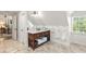 Bathroom with a rustic vanity, white marble countertop, and tiled flooring at 135 River Ne Lndg, Sandy Springs, GA 30350