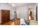 Well-lit bedroom featuring hardwood floors, light purple walls and dance equipment at 135 River Ne Lndg, Sandy Springs, GA 30350