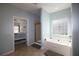 Relaxing bathroom with a soaking tub, walk-in shower and a view into the main bedroom at 172 Cherokee Reserve Cir, Canton, GA 30115