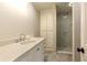 Bathroom featuring modern vanity and glass-enclosed walk-in shower at 260 Pinebrook Way, Roswell, GA 30076