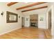 Vaulted living room with stone fireplace, wooden beam ceiling and hardwood floors at 260 Pinebrook Way, Roswell, GA 30076