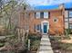 Brick townhome with black shutters and landscaped front yard with walkway at 2931 Lavista Way, Decatur, GA 30033