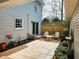 Private patio with wood fence and decorative fountain, surrounded by lush plantings at 2931 Lavista Way, Decatur, GA 30033