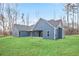 Expansive backyard with lush lawn, and a covered patio that is great for entertaining outdoors at 602 Sandhill Hickory Level Rd, Carrollton, GA 30116