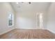 Bright bedroom with high ceilings, a ceiling fan, wood-look floors and an ensuite bathroom at 602 Sandhill Hickory Level Rd, Carrollton, GA 30116