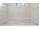 Walk-in closet with wire shelving and tile floors, offering plenty of space at 602 Sandhill Hickory Level Rd, Carrollton, GA 30116