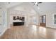 Open floor plan showcases seamless transition from living room to kitchen with high ceilings and hardwood floors at 602 Sandhill Hickory Level Rd, Carrollton, GA 30116