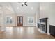Spacious living room with fireplace and hardwood floors provides a comfortable and elegant gathering space at 602 Sandhill Hickory Level Rd, Carrollton, GA 30116