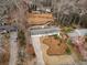 A captivating aerial view showcases the property's layout, tree coverage, and neighborhood setting at 665 Lake Charles Way, Roswell, GA 30075