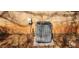 Shot of the air conditioning unit located in the backyard of the property, next to the exterior brick wall at 3747 Southland Ct, Atlanta, GA 30344
