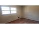 Bedroom with a window for natural light and hardwood flooring at 3747 Southland Ct, Atlanta, GA 30344