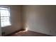 Shows a sunlit bedroom with hardwood floors and a bright window at 3747 Southland Ct, Atlanta, GA 30344