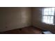 Bedroom featuring a window for natural light and hardwood floors at 3747 Southland Ct, Atlanta, GA 30344