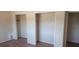 Bedroom featuring multiple closets with natural light at 3747 Southland Ct, Atlanta, GA 30344