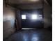 A garage with a dark door and limited lighting coming through the small windows at 3747 Southland Ct, Atlanta, GA 30344