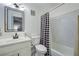 Bathroom featuring a modern vanity and a shower with a stylish curtain at 6700 Roswell Rd # 32C, Atlanta, GA 30328
