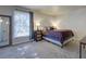 Comfortable bedroom with soft carpet, a large window, and ample natural light at 6700 Roswell Rd # 32C, Atlanta, GA 30328