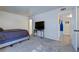 Spacious bedroom with a large window, carpet floors, and access to the ensuite bathroom at 6700 Roswell Rd # 32C, Atlanta, GA 30328