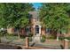 Charming brick home with a manicured lawn and lush, mature trees adding to its curb appeal at 6700 Roswell Rd # 32C, Atlanta, GA 30328