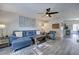 Comfortable living room with a sectional sofa, accent chair, and easy access to the kitchen at 6700 Roswell Rd # 32C, Atlanta, GA 30328